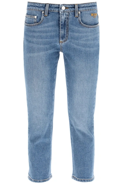 Shop Msgm Cropped Jeans With Rhinestone Logo In Blu (blue)