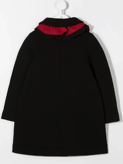 Shop Touriste Ruffle Front Coat In Black