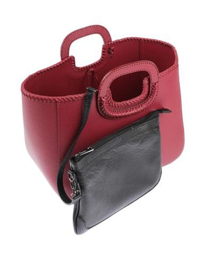Shop Almala Handbags In Red