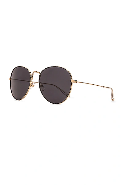 Shop Givenchy Metal Round Sunglasses In Gold & Grey Blue