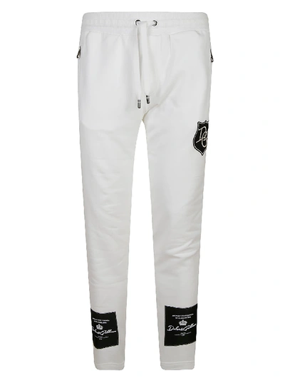 Shop Dolce & Gabbana Logo Patched Track Pants In White