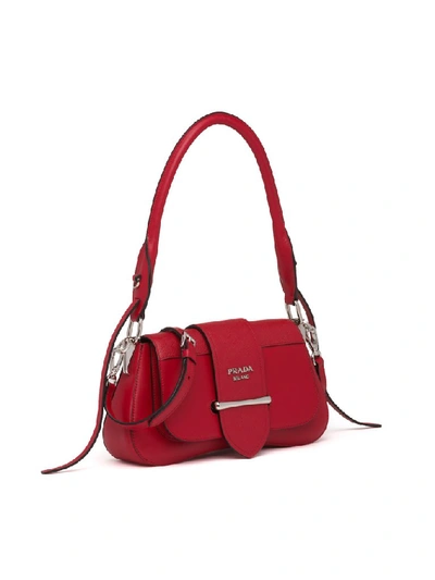 Shop Prada Sidonie Buckled Shoulder Bag In Red