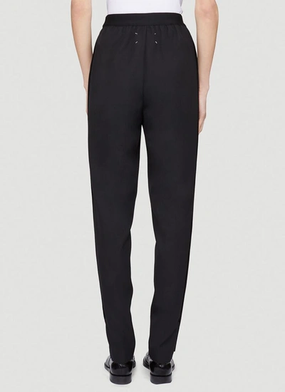 Shop Maison Margiela Tapered Trousers In Black