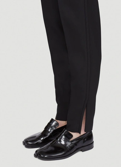 Shop Maison Margiela Tapered Trousers In Black