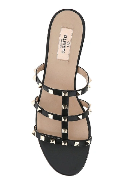 Shop Valentino Garavani Rockstud Flat Slide Sandals In Black