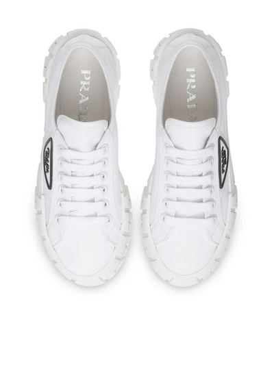 Shop Prada Logo Plaque Tyre Low Top Sneakers In White