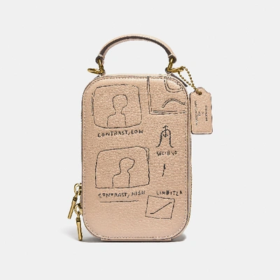 Shop Coach X Jean Michel Basquiat Alie Camera Bag In Color<lsn_delimiter>brass/ivory
