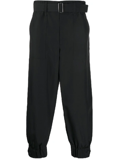 Shop Issey Miyake Buttoned-ankle Tapered Trousers In Black