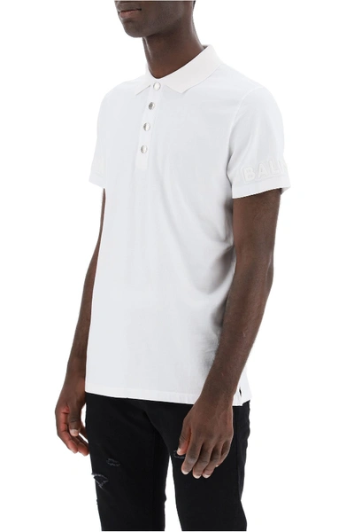 Shop Balmain Polo Shirt With Embossed Logo In Blanc