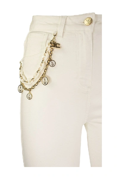 Shop Elisabetta Franchi Denim Trousers With Charms Ivory