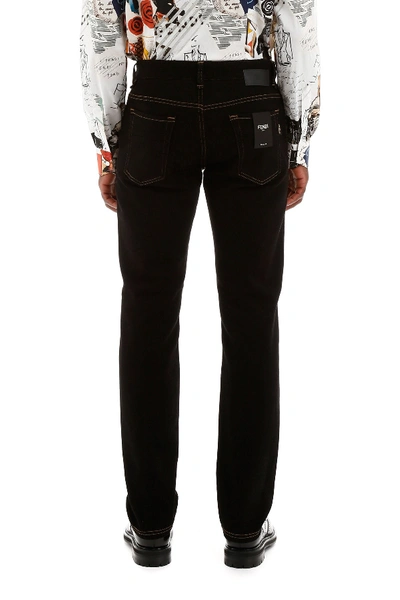 Shop Fendi Karligraphy Jeans In Nero