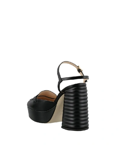 Shop Fendi Sandals In Nero