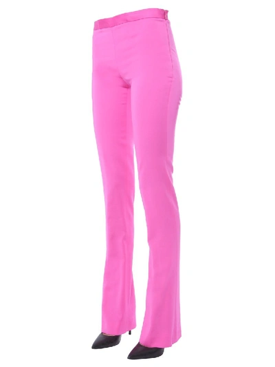 Shop Versace Flared Trousers In Fuchsia