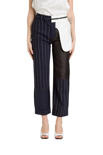 Shop Monse Inside-out Pinstripeds Trousers In Blu