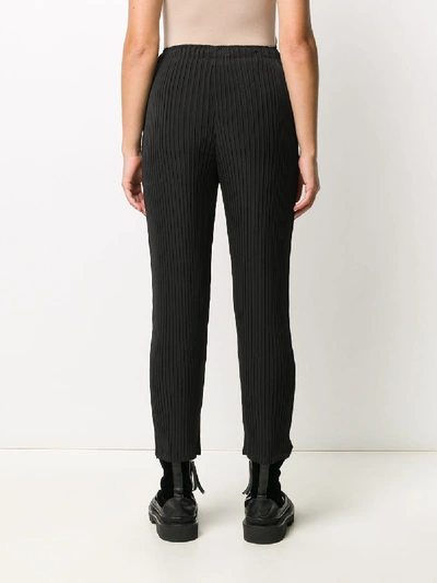 Shop Issey Miyake Trousers In Nero