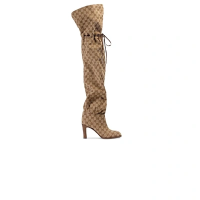 Shop Gucci Knee Boots With Gg Print In Oro