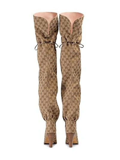 Shop Gucci Knee Boots With Gg Print In Oro