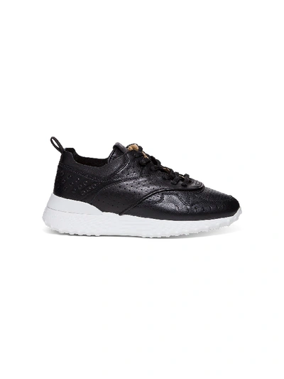 Shop Tod's Leather Sneakers In Black