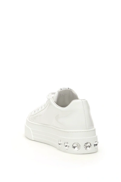 Shop Miu Miu Crystal Patent Sneakers In Bianco