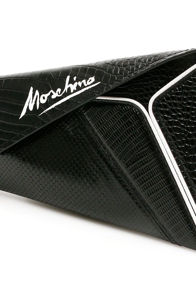Shop Moschino Asymmetrical Clutch With Signature Logo In Fantasia Nero