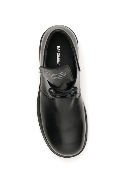 Shop Raf Simons Text Embossed Derby Shoes In Black