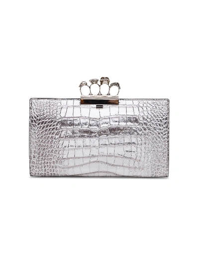 Shop Alexander Mcqueen Skull Four Ring Clutch Bag In Metallic