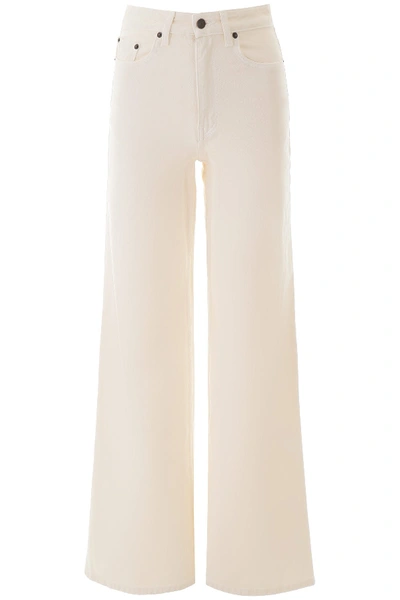Shop The Row Flared Jeans In Vanilla