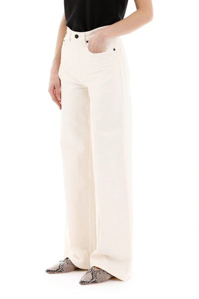 Shop The Row Flared Jeans In Vanilla