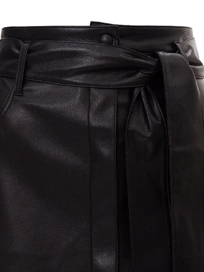 Shop Nanushka Vegan Leather Belted Mini Skirt In Black