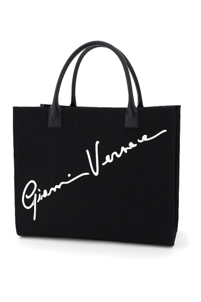 Shop Versace Canvas Tote Bag With Logo Signature In Nero Bianco Ottico Oro Tribute