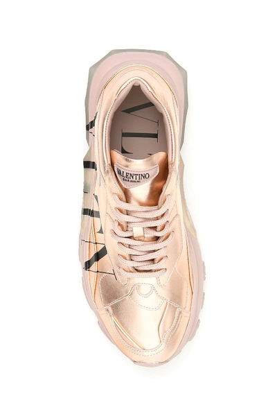 Shop Valentino Vltn Laminated Leather Sneakers In Nero