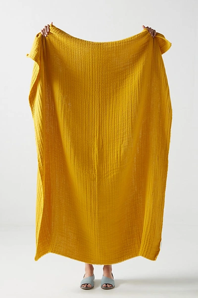 Shop Anthropologie Airy Gauze Throw Blanket In Yellow