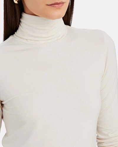 Shop L Agence Aja Jersey Turtleneck Top In Ivory