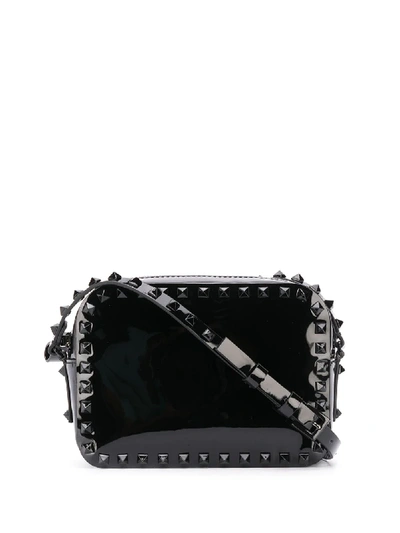 Shop Valentino Small Rockstud Crossbody Bag In Black
