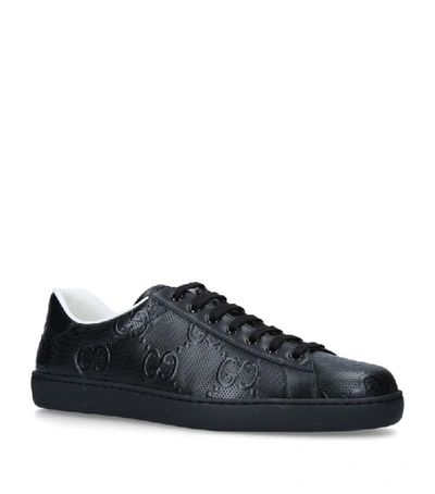 Shop Gucci Leather Embossed Ace Sneakers