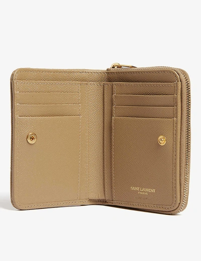 Shop Saint Laurent Monogram Leather Zip-around Wallet In Gold