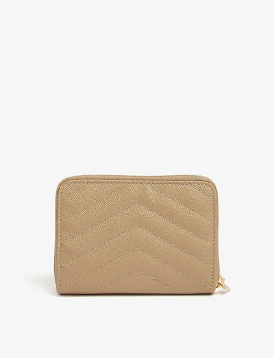 Shop Saint Laurent Monogram Leather Zip-around Wallet In Gold