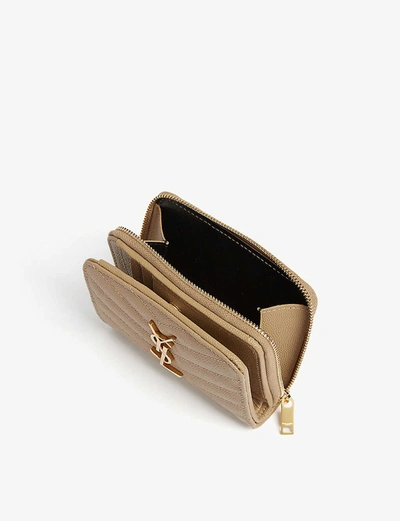 Shop Saint Laurent Monogram Leather Zip-around Wallet In Gold