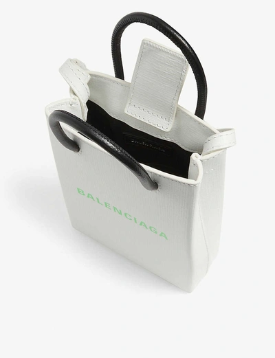 Shop Balenciaga Phone Holder Mini Leather Shopper In White / Light Green