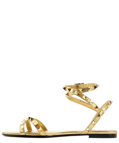Shop Valentino Garavani Rockstud Sandals In Gold