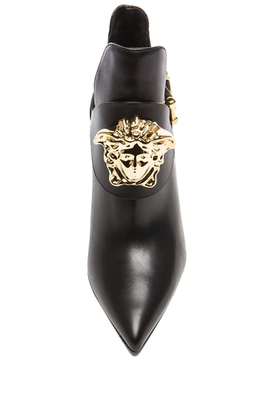 Shop Versace Medusa Head Leather Booties In Black & Gold