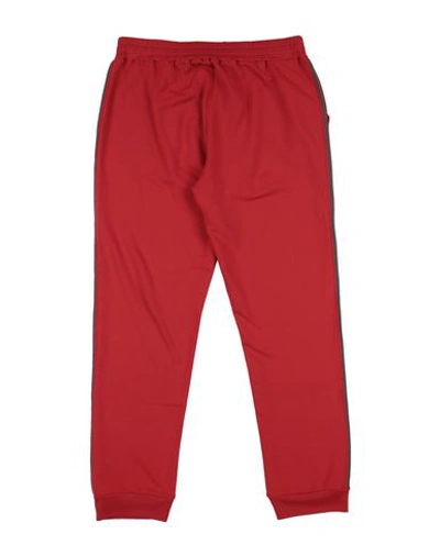 Shop Touriste Casual Pants In Red