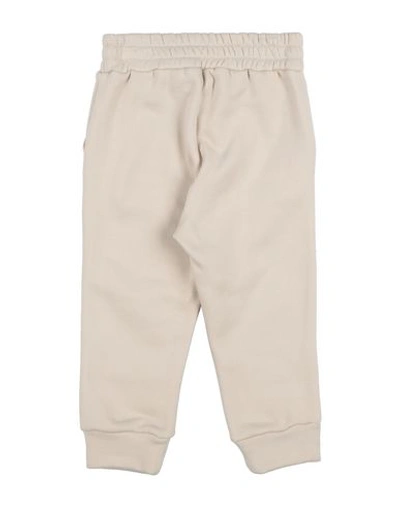 Shop Touriste Casual Pants In Ivory