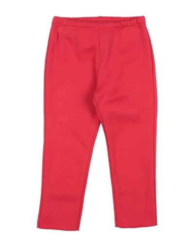 Shop Touriste Pants In Red