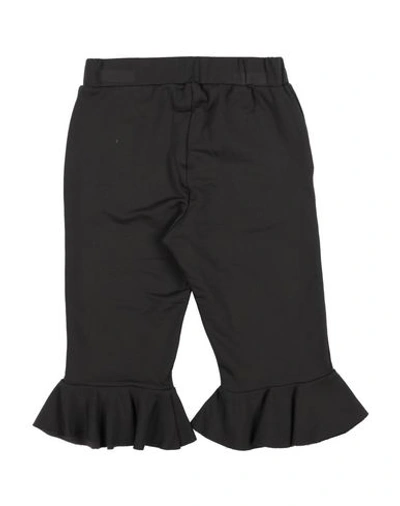 Shop Touriste Casual Pants In Black
