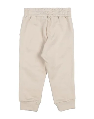 Shop Touriste Casual Pants In Ivory