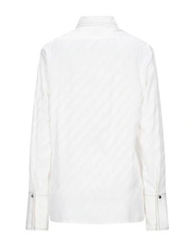 Shop Sandro Solid Color Shirts & Blouses In White