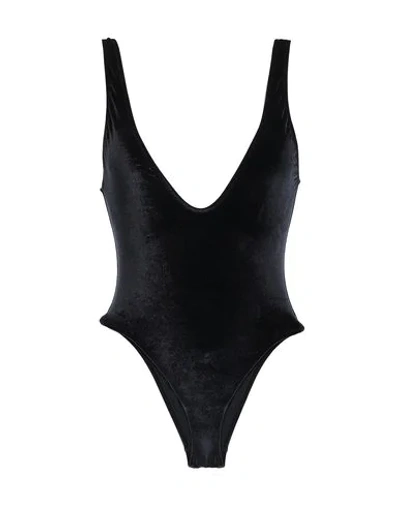 Shop Solid & Striped One-piece Swimsuits In Black