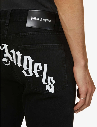 Shop Palm Angels Logo-print Tapered Denim Jeans In Black+white