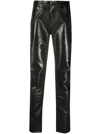 Shop Saint Laurent Coated Skinny Jeans In Black